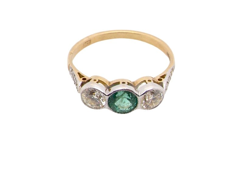 An Emerald & Diamond three stone ring