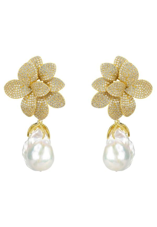 Gold flower-shaped earrings with pearl drops on a white background