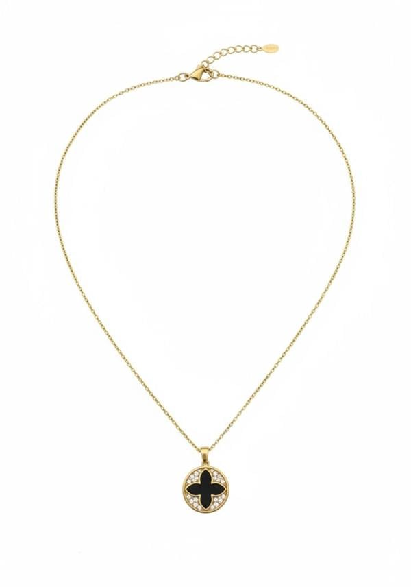 Gold necklace with a black pendant on a white background