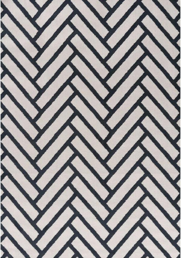 Rug with a black and white herringbone pattern