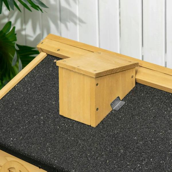 Dark asphalt roof corner with wooden support on outdoor rabbit hutch