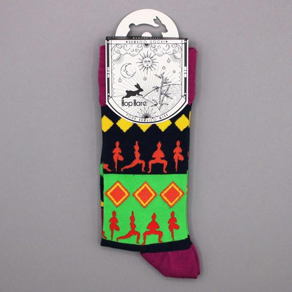 Single bamboo yoga sock on retail card with multicolor silhouette pattern