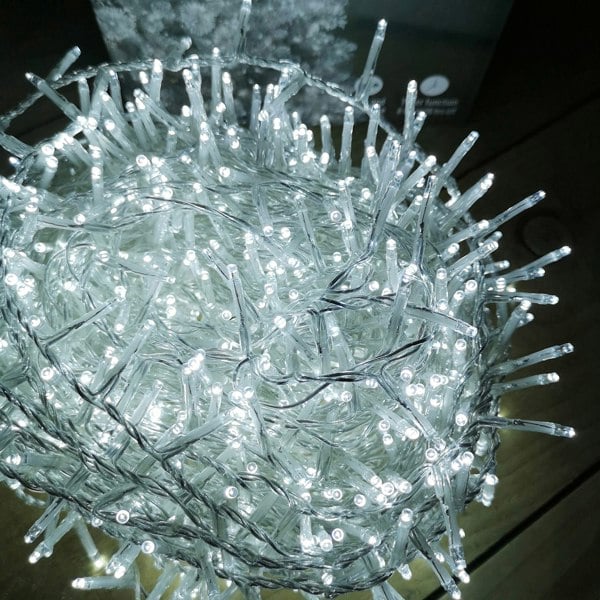Samuel Alexander 1000 LED 25m Indoor Outdoor Christmas Multi Function Mains Operated String Lights with Timer & Clear Cable in Cool White