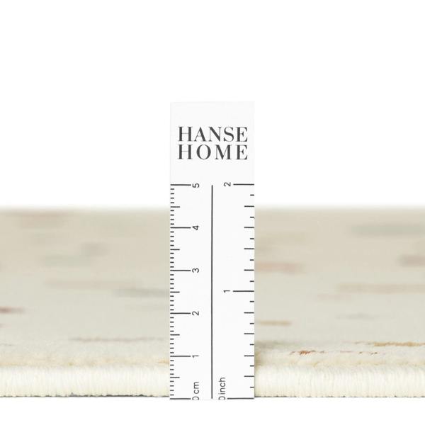 Close-up of a textured fabric swatch with a ruler and 'HANSE HOME' branding.