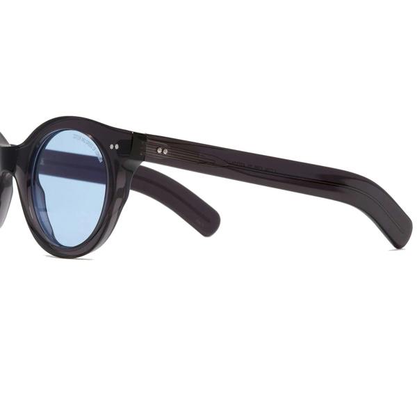 Cutler & Gross 1390 round sunglasses in black on blue