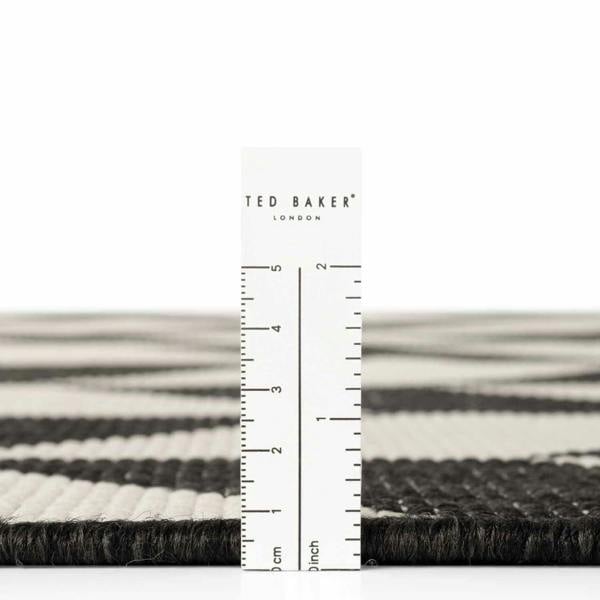 Ted Baker London rug with a ruler for scale on a white background