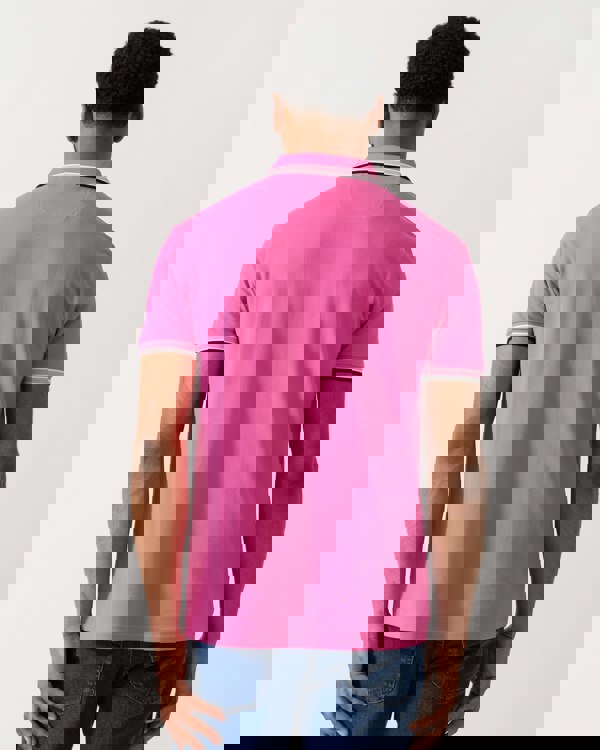 back shot of a model wearing a BOSS Green Paddy Mens Cotton-Piqué Polo Shirt with Contrast Logo in Bright Pink