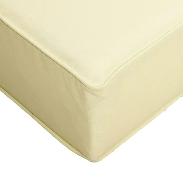 Beige cushion corner with piped seam and curved edge