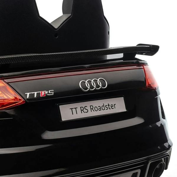 Black Audi TT RS ride-on car rear with TT RS badge, Audi rings and red tail light