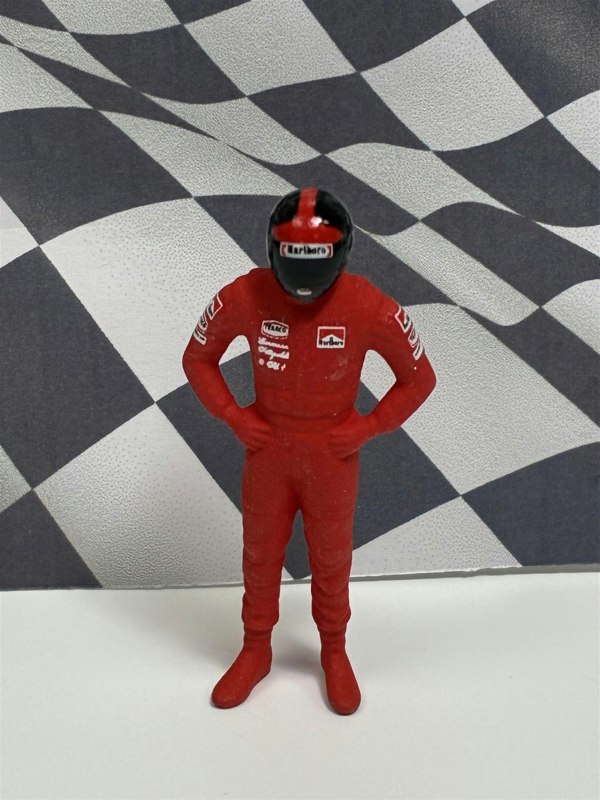 a toy figure in a red uniform