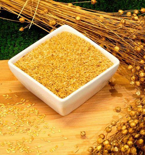Whole gold flaxseed and flax plant