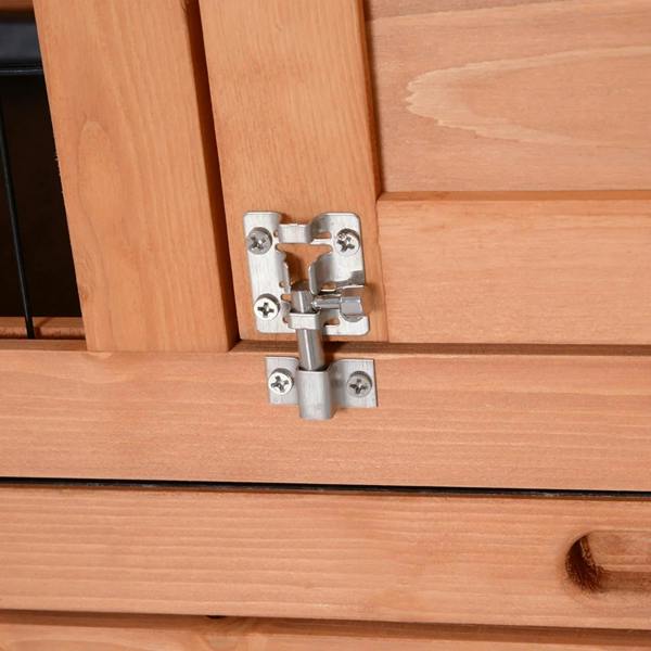 Orange wooden rabbit hutch latch and hinge hardware on a side door