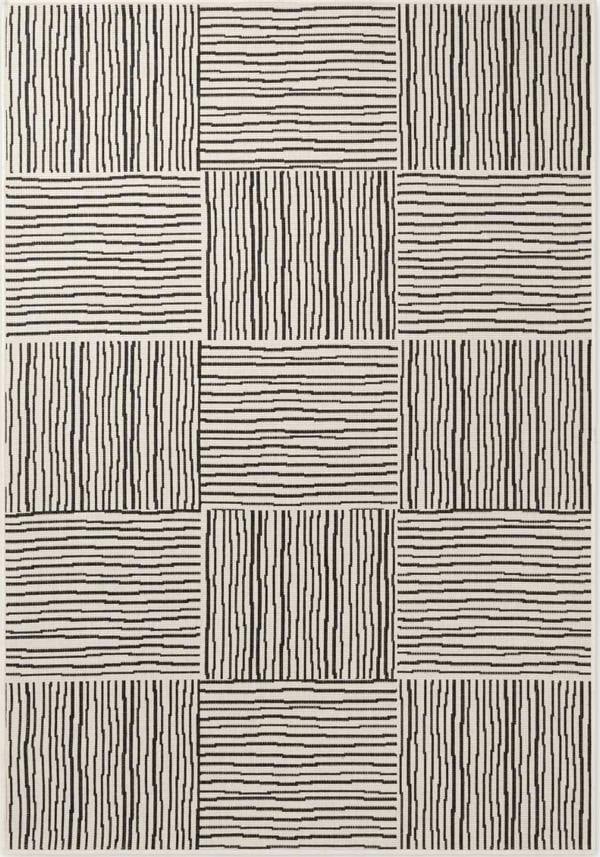 Patterned rug with black lines on a beige background