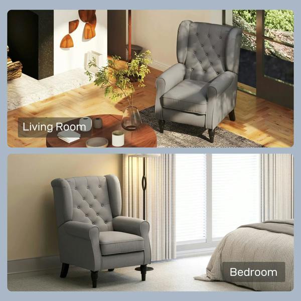 Dark grey wingback armchair with tufted back, rolled arms, and black turned legs