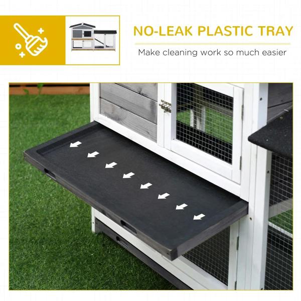 Grey rabbit hutch tray ramp with black textured surface and wire-mesh sides