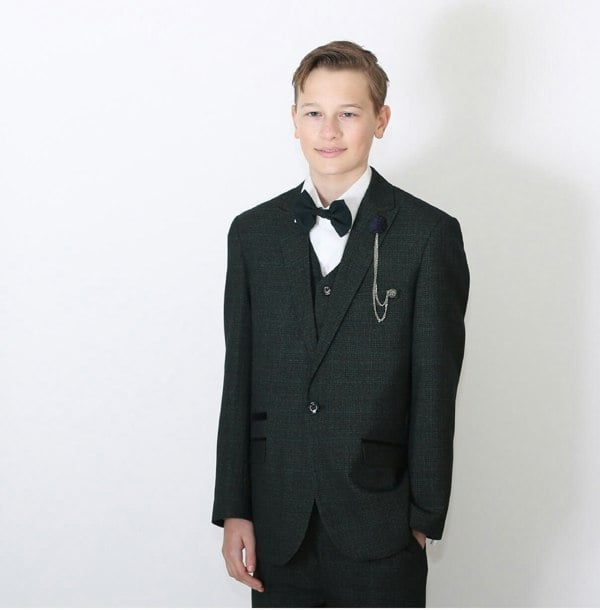 Young boy wearing suit