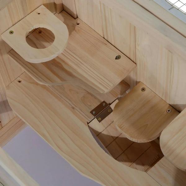 Natural wood hamster cage interior with circular access opening and metal hinge