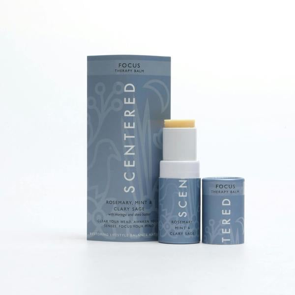 Focus Aromatherapy Balm with cap off and twisted up with eco sleeve packaging on a white background