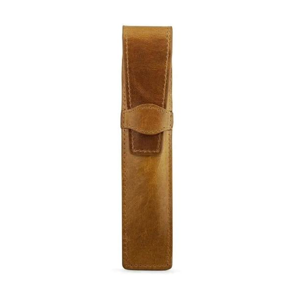 Tan leather pen holder on a white background
