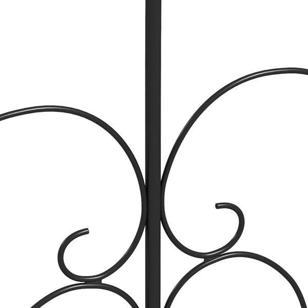 Black metal fence panel scroll detail with curled flourishes at the center post