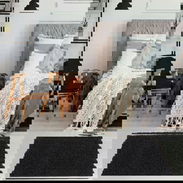 Black shaggy Rug Plain design thick pile, high quality, soft & durable.