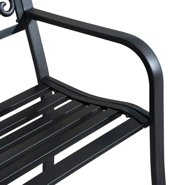 Black curved armrest and slatted seat on a garden bench, angled view