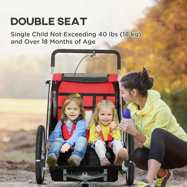 Red baby bike trailer with child bench seats and visible 5-point safety harness