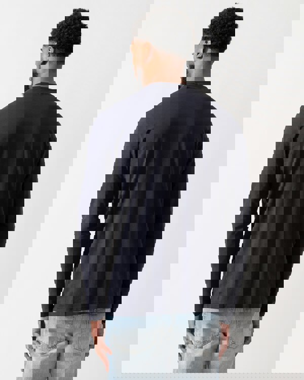 back of a model wearing a BOSS Green Tee Mens Stretch-Cotton T-Shirt with Contrast Logo in Dark Blue