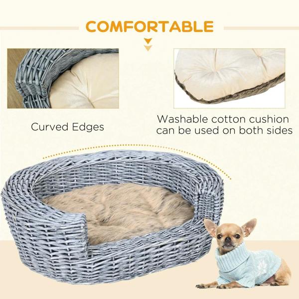 Grey wicker pet bed with beige cushion, curved edges detail