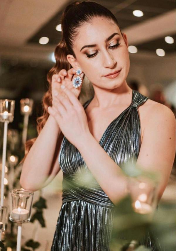 The earring worn by a model.