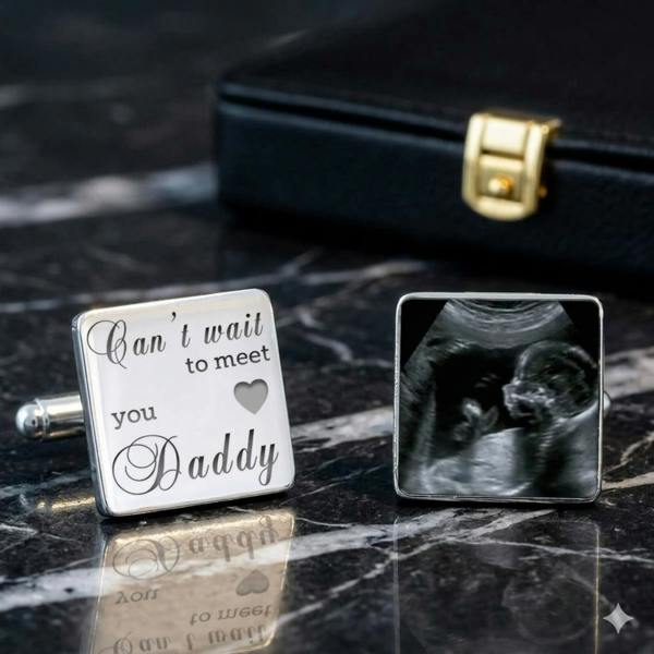 Personalised baby scan cufflinks by Abode Home & Gifts featuring engraved text and an ultrasound photo on a dark marble surface.