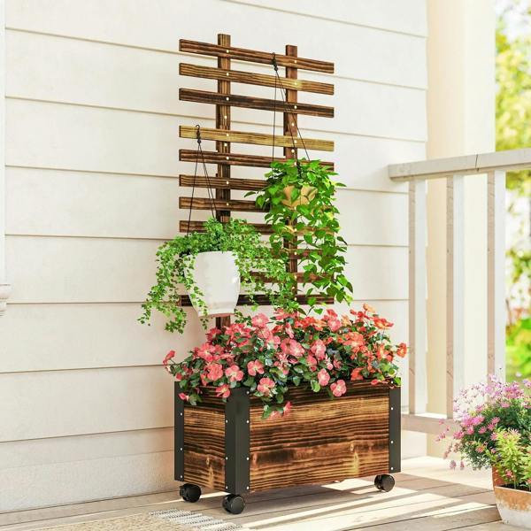 Carbonised wooden raised planter box with lattice trellis and caster wheels