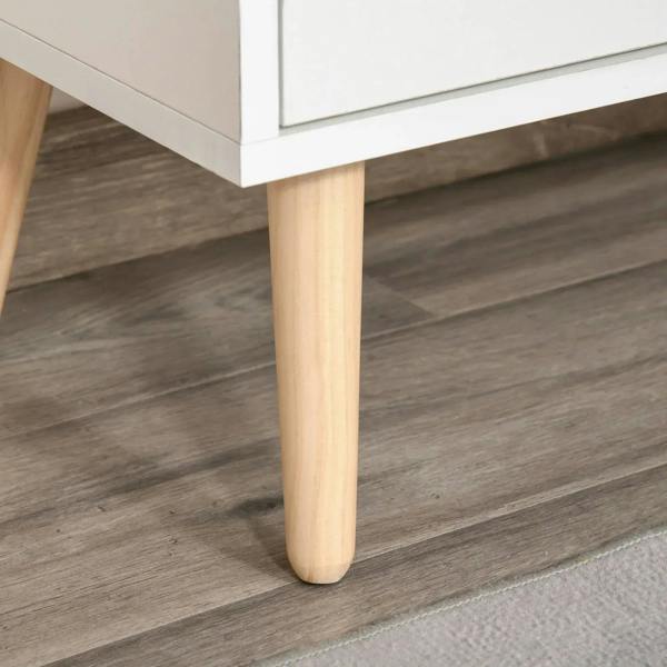 Bottom view of white sideboard on light wood tapered legs.