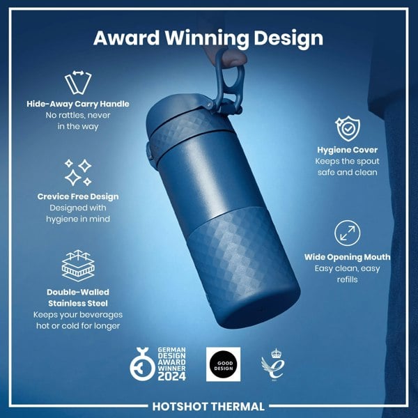 A dark-blue, double-walled stainless steel bottle is being held; it features a hide-away handle and a wide mouth for easy cleaning. The bottle's design prioritizes hygiene, and it keeps beverages hot or cold longer. It's an award-winning design.