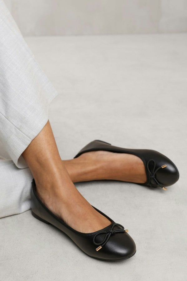 Where's That From Tallulah Wide Fit Slip on Flat Pumps in Black Faux Leather