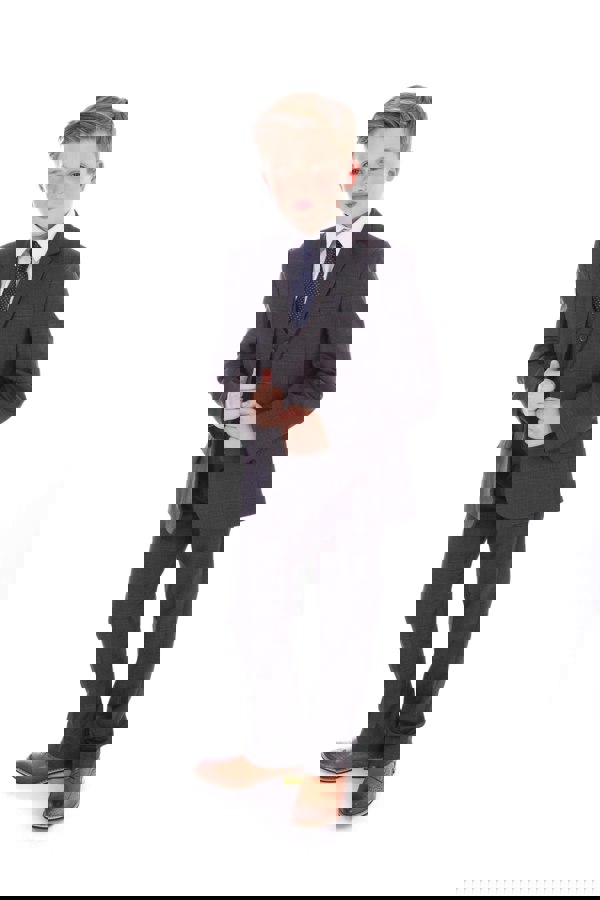 young boy wearing grey suit