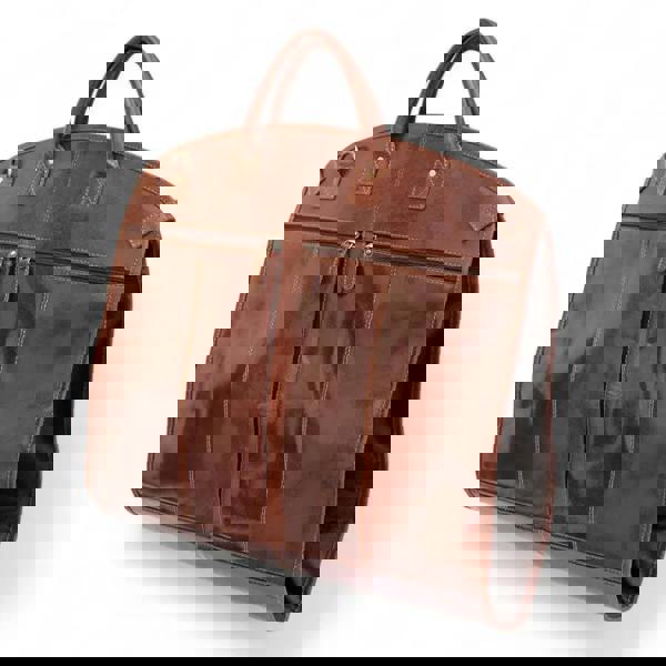 Cognac leather garment carrier with zippers on a white background