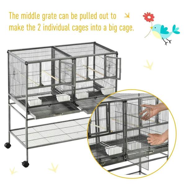 Black bird cage with divider grate that pulls out to create one larger cage