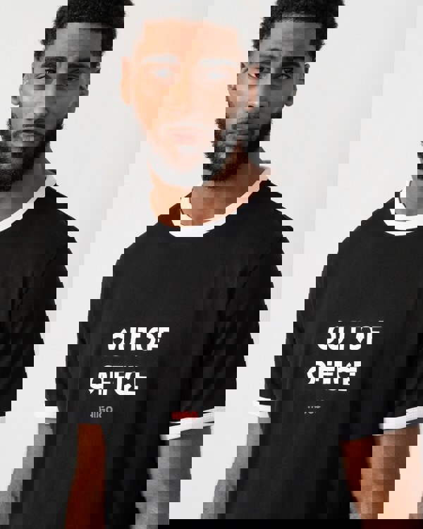 close up of a model wearing a HUGO Doffice Mens T-Shirt in Black