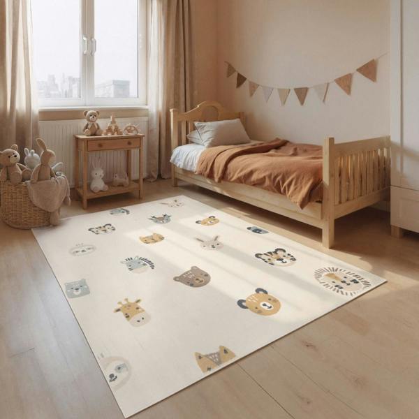 Children's room with a bed and a rug featuring animal illustrations.