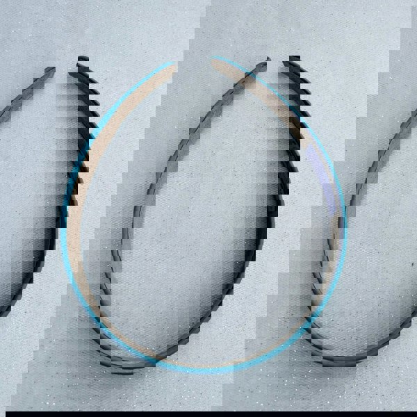 Teal hairband, smooth satin finish, slim padded design, vibrant teal colour, classic everyday accessory, elegant minimalist headband
