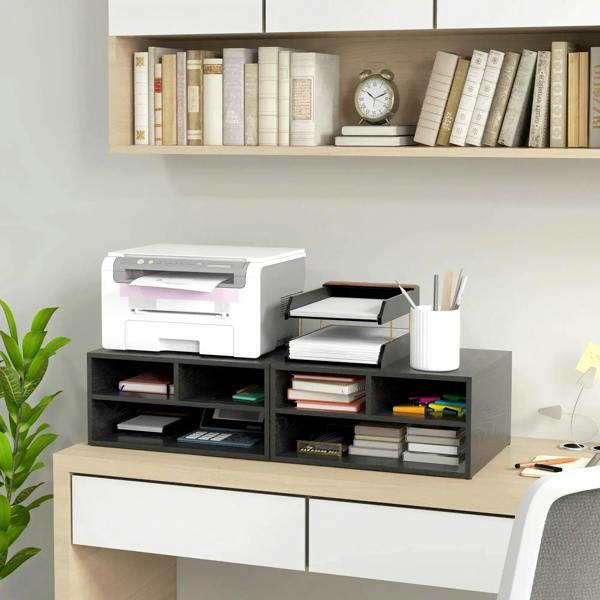 Black printer storage cabinet with three open compartments holding books and printer