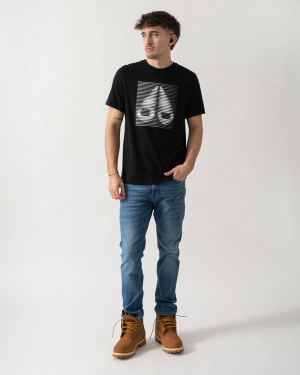 full length shot of a model wearing a Moose Knuckles Raydaze Mens T-Shirt in Black 292