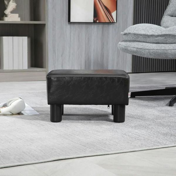 Dark PU leather cube ottoman with rounded corners and four black plastic legs, square seat.