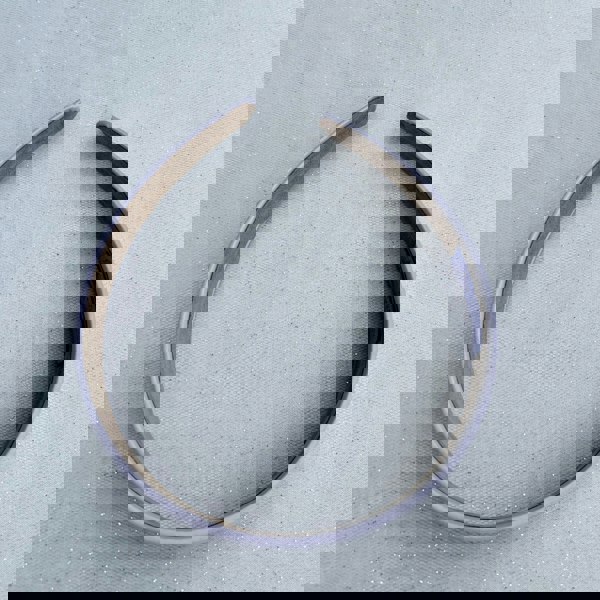 Lilac hairband, smooth satin finish, soft pastel purple shade, padded structure, minimalist elegant design, versatile everyday accessory
