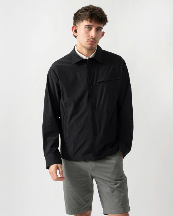 studio shot of a model wearing an Armani Exchange Mens Jacket XM002818-AF22572 in Black UC001
