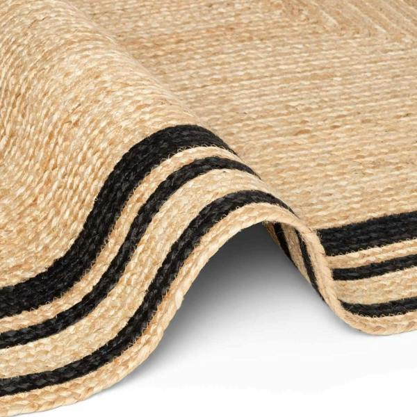Close-up of a woven mat with black stripes on a white background