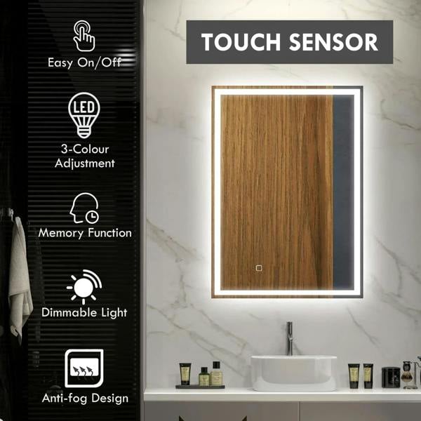 Rectangular LED bathroom mirror with bright white border on a wall