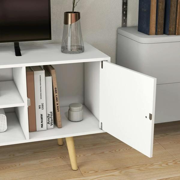 White TV stand cabinet interior with open shelf and storage compartment door.