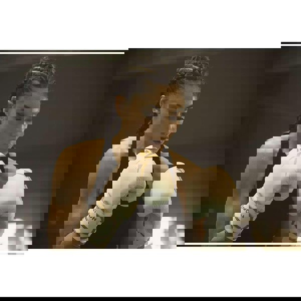 Woman wearing Reebok Boxing Gloves - White and Gold